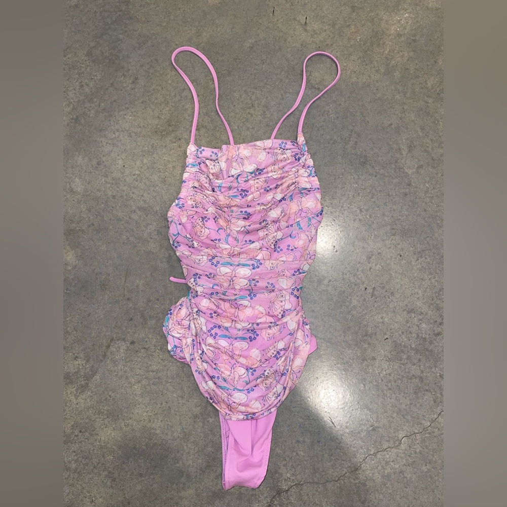 Free people body suit. Corset back and criss-cross straps. Never worn. Size M